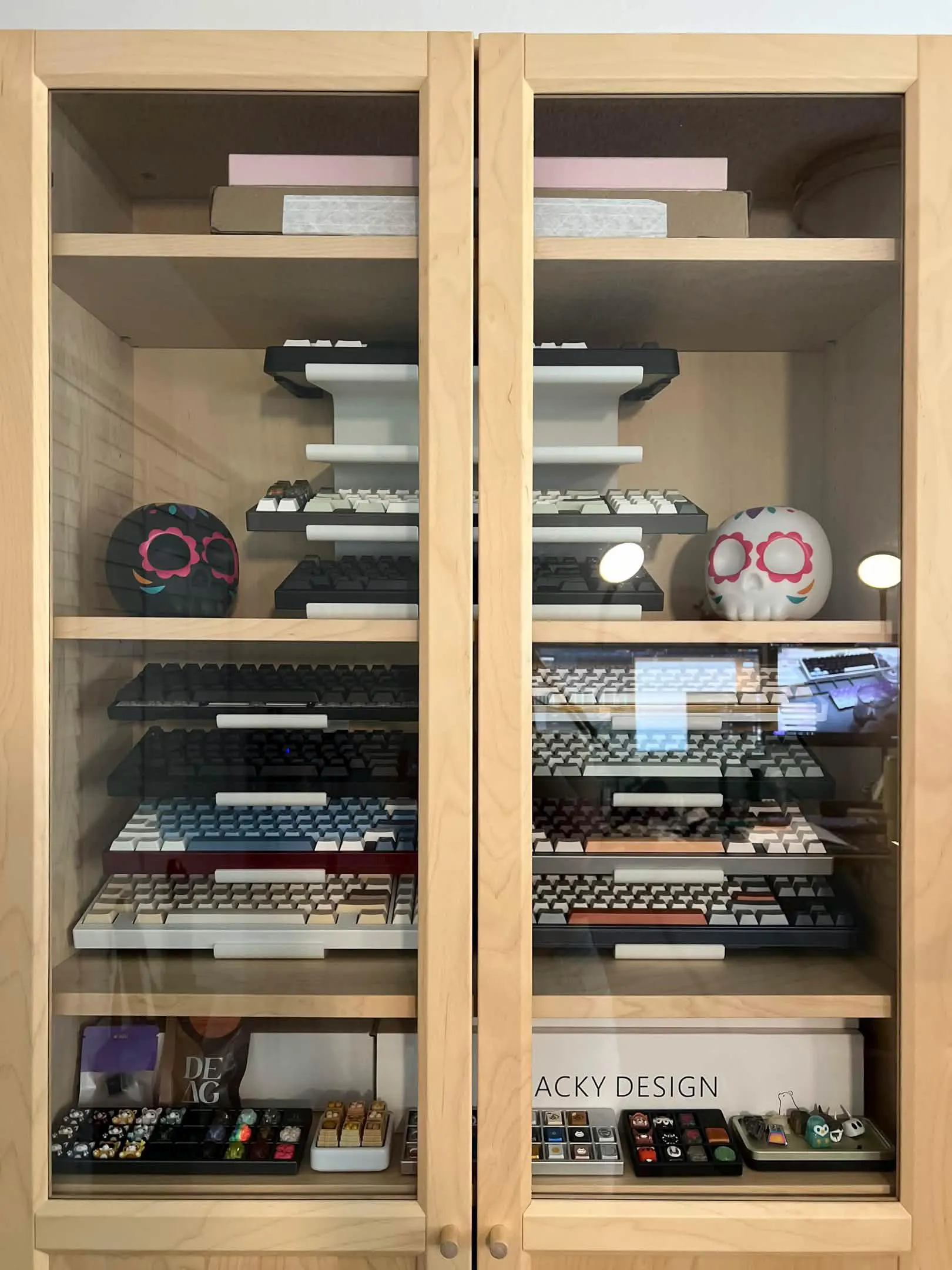 Keyboard stands arranged inside a glass-front display cabinet